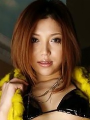 Gorgeous Japanese babe Aki Anzai is posing in sexy clothes here